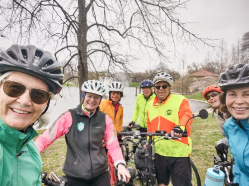 Group of older adults outside dressed in bike gear