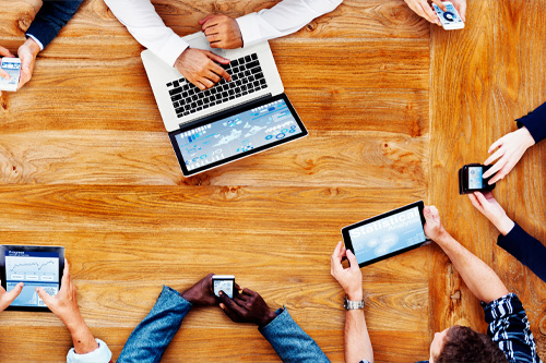 Aerial view of a group of people using technology