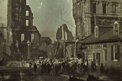 A crowd of people gather in front of the ruins of the Lindell Hotel after the fire on 30 March 1867.